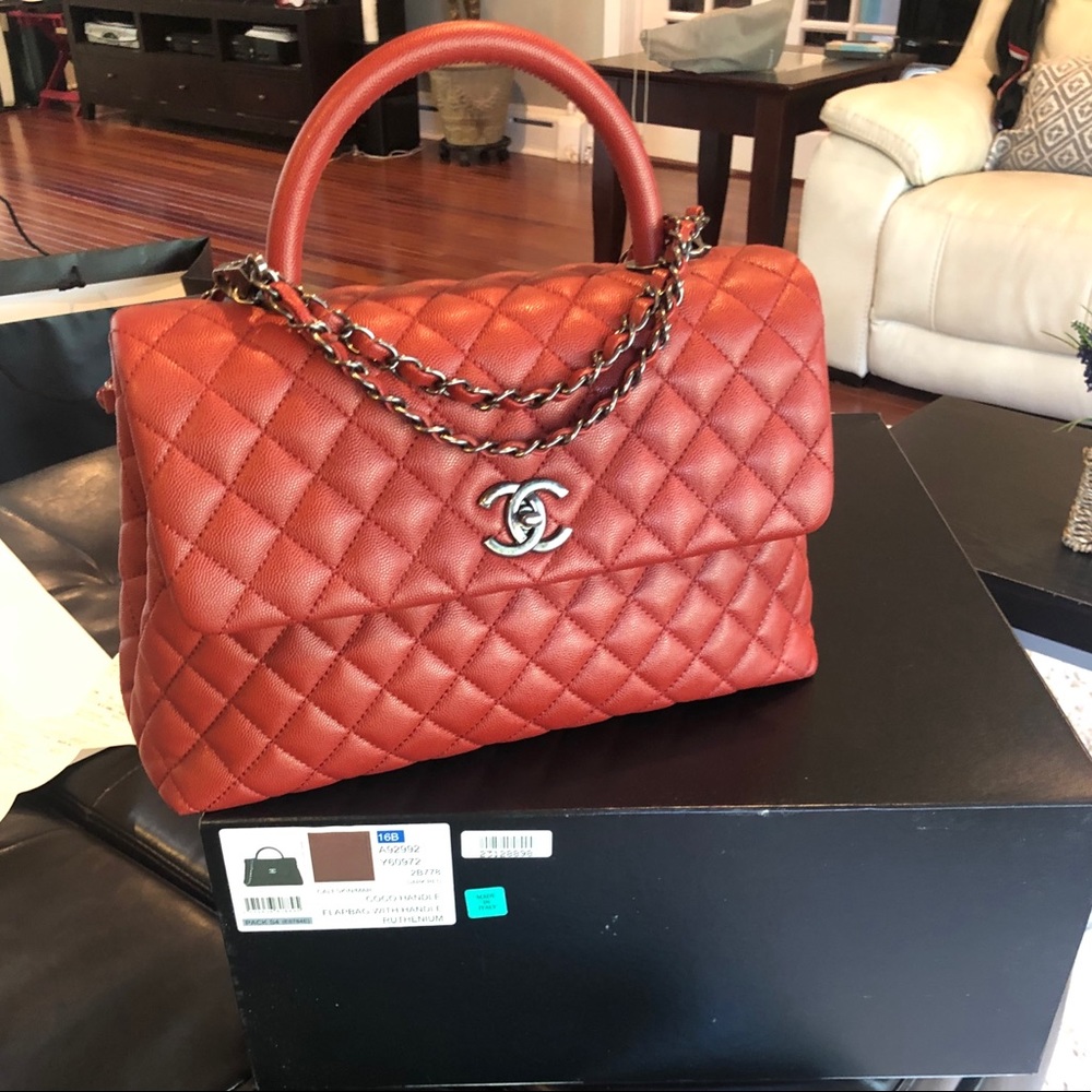 CHANEL Caviar Medium Coco Handle Flap in Red.